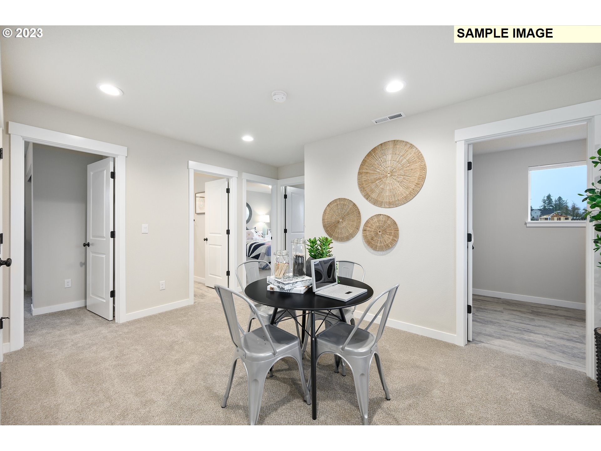 733 North Russet Place, Unit 193 Ridgefield, WA 98642 - Photo 31 of 34 a view of a dining room and kitchen with a table and chairs