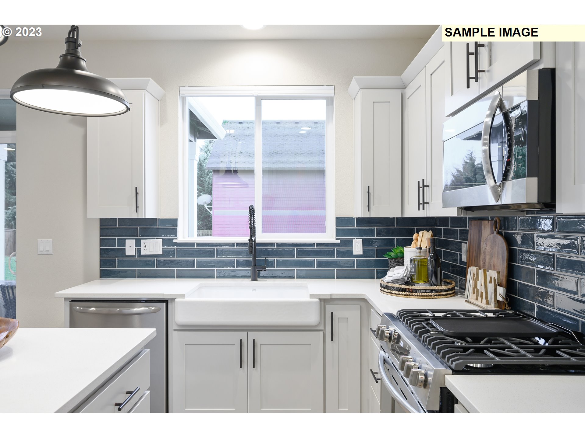 733 North Russet Place, Unit 193 Ridgefield, WA 98642 - Photo 6 of 34 a kitchen with stainless steel appliances a sink stove and a window