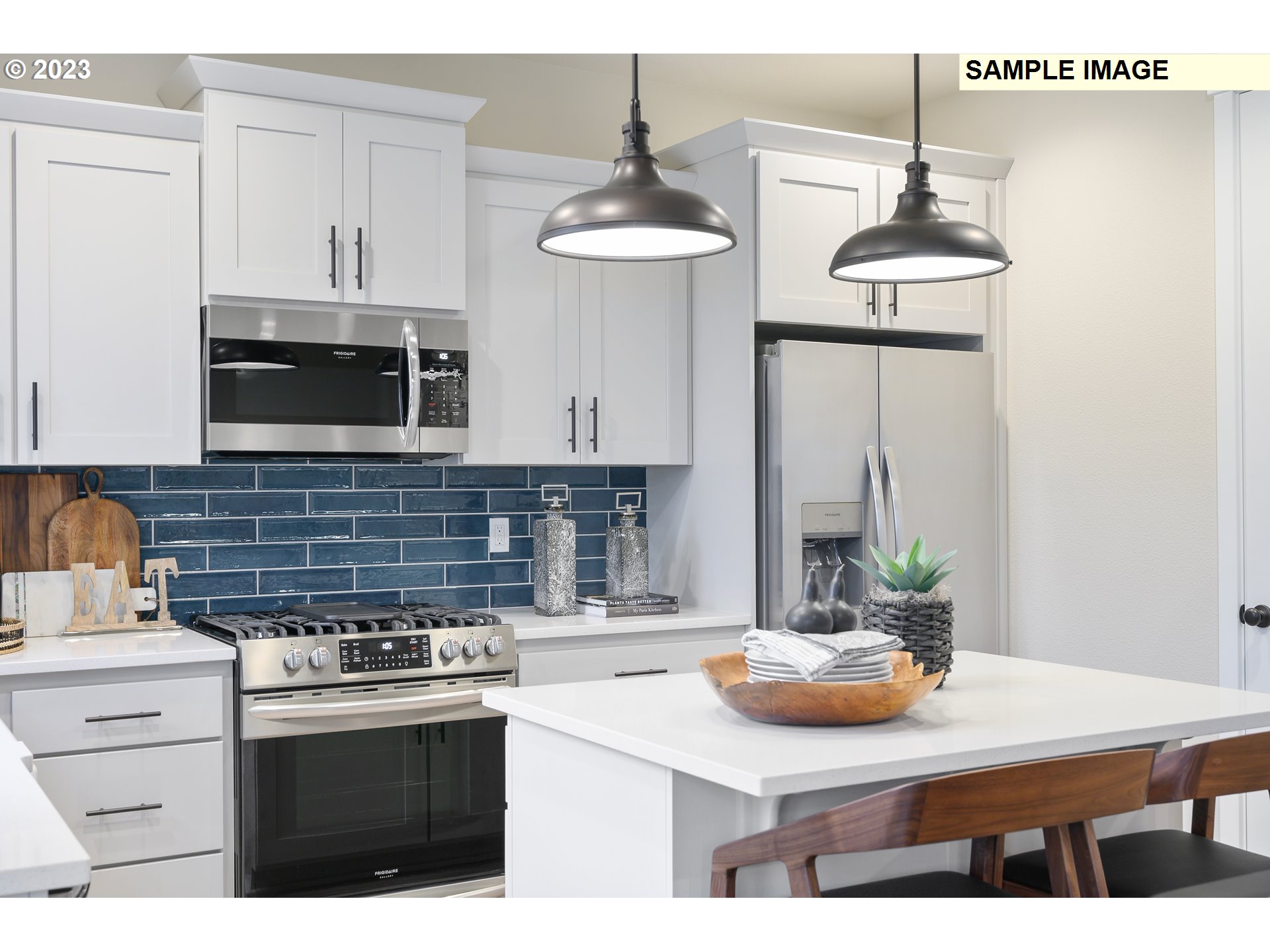 733 North Russet Place, Unit 193 Ridgefield, WA 98642 - Photo 8 of 34 a kitchen with stainless steel appliances a stove a sink and a white cabinets