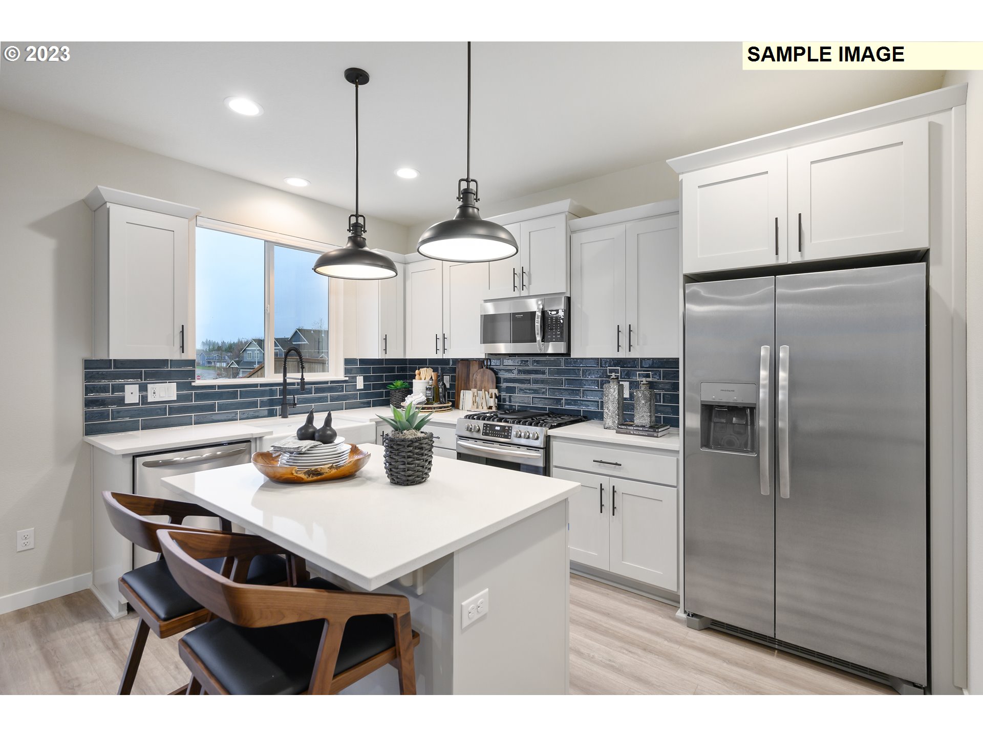 733 North Russet Place, Unit 193 Ridgefield, WA 98642 - Photo 10 of 34 a kitchen with a sink stainless steel appliances and cabinets