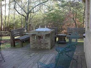 277 Battleground Road Kings Mountain, NC 28086 - Photo 3 of 8 a view of a patio with table and chairs with wooden floor and fence