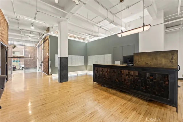 a room with lots of wooden furniture and a chandelier