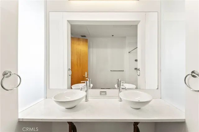 a bathroom with a sink and a large mirror