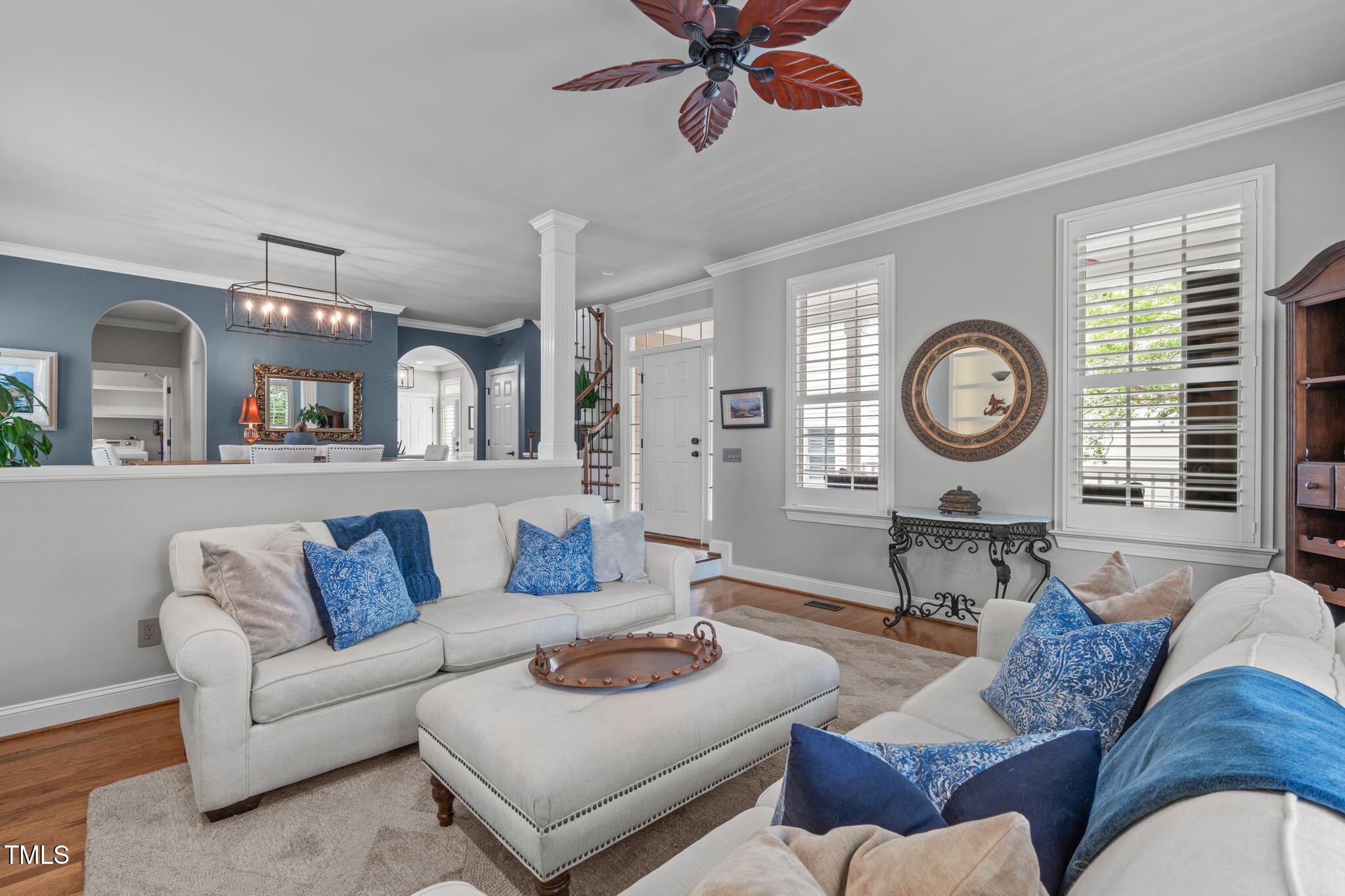 321 Commons Walk Circle Cary, NC 27519 - Photo 14 of 54 a living room with furniture a clock on wall and a window