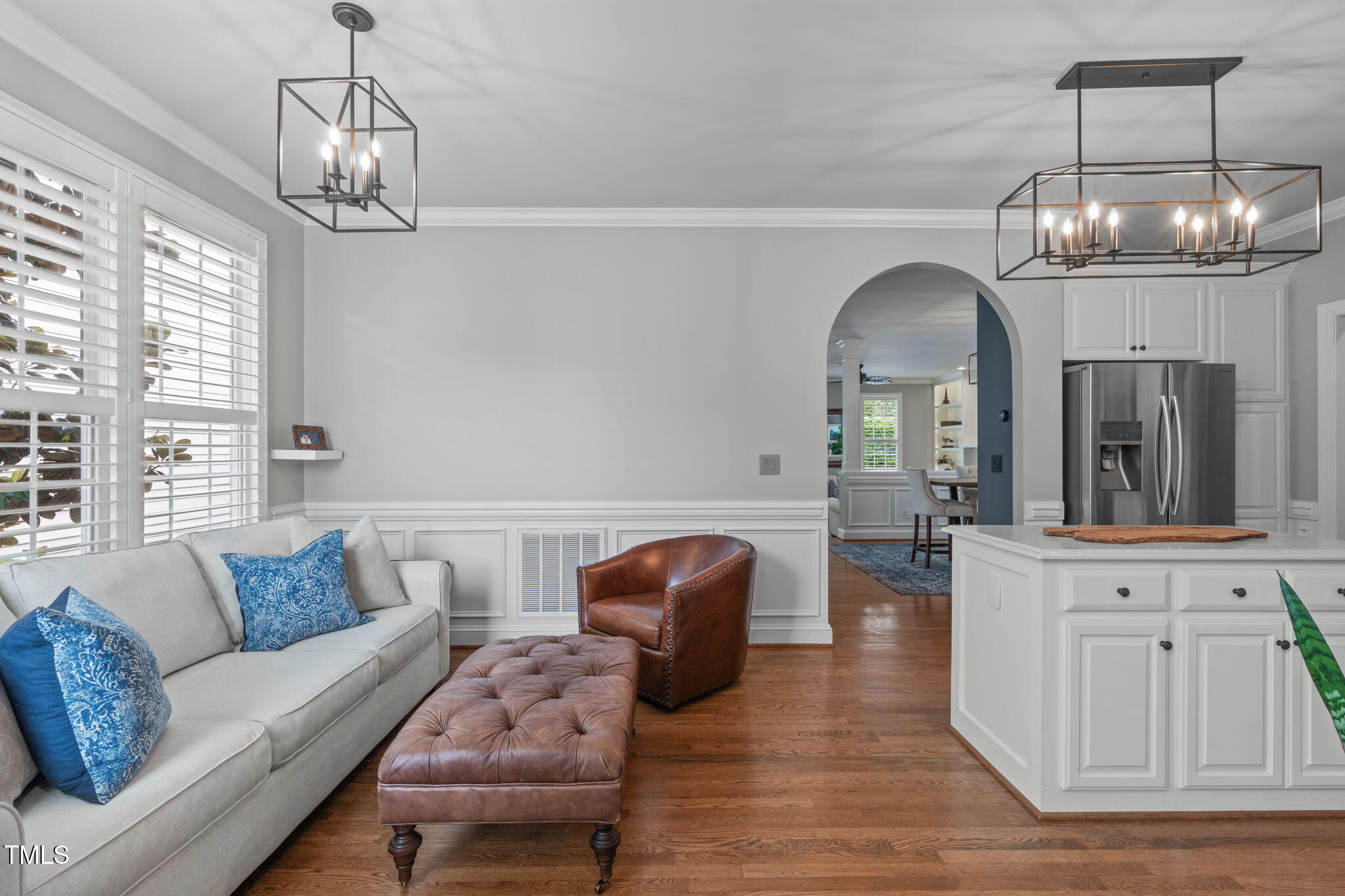 321 Commons Walk Circle Cary, NC 27519 - Photo 20 of 54 a living room with furniture chandelier and a chandelier