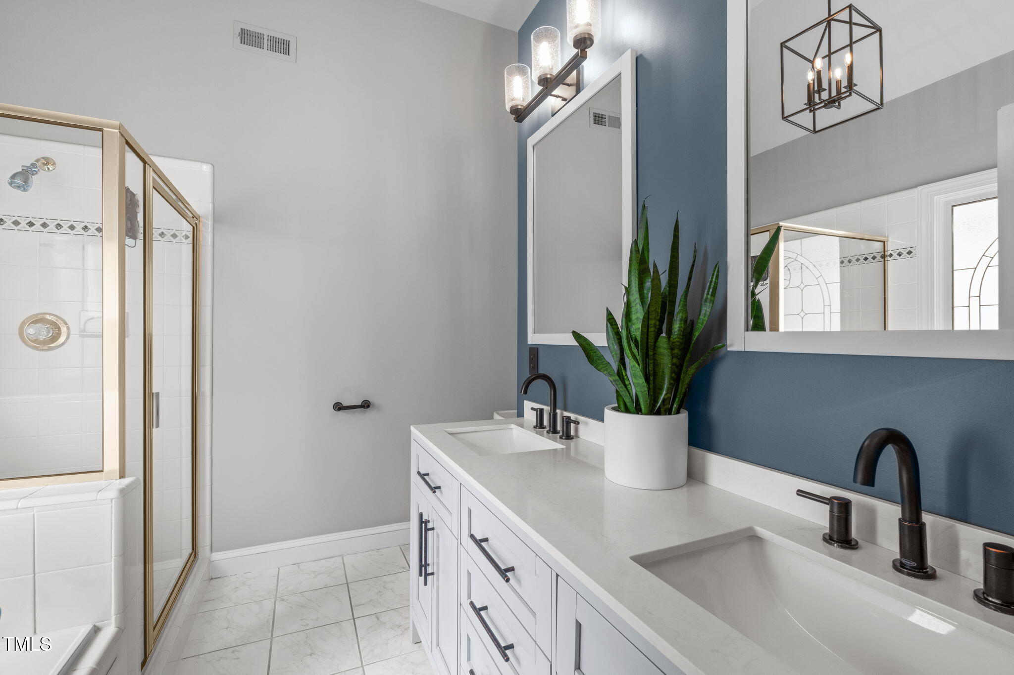 321 Commons Walk Circle Cary, NC 27519 - Photo 24 of 54 a kitchen with a refrigerator and a sink