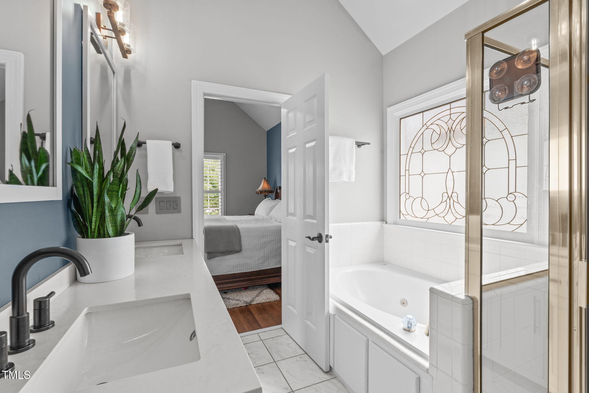 321 Commons Walk Circle Cary, NC 27519 - Photo 25 of 54 a bath room with a bathtub and a shower