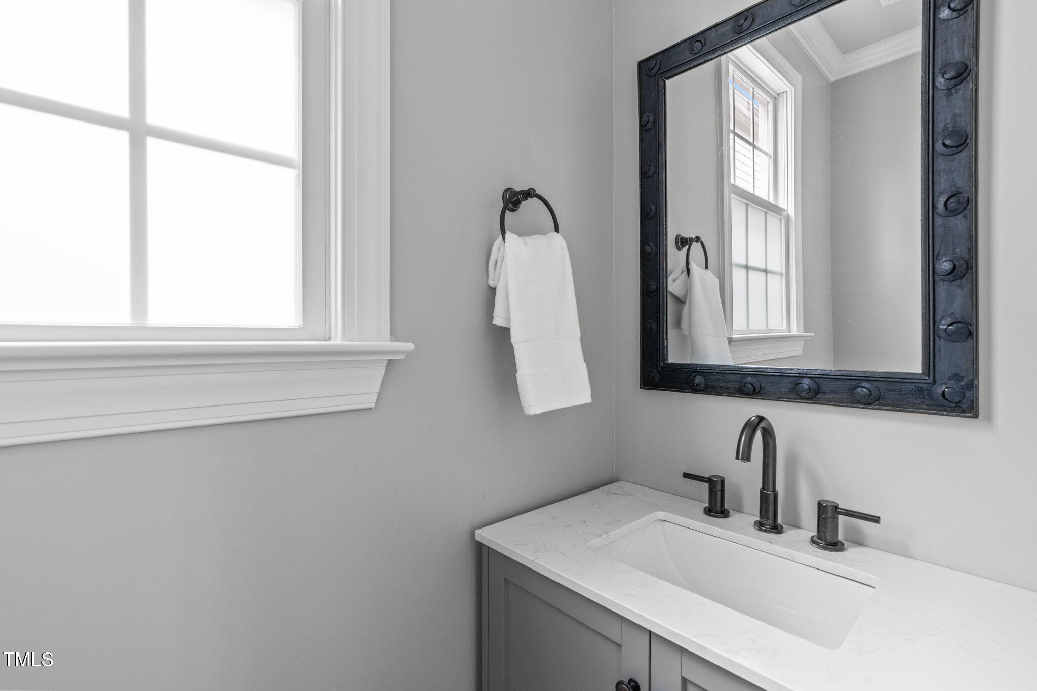 321 Commons Walk Circle Cary, NC 27519 - Photo 28 of 54 a bathroom with a sink vanity and a mirror