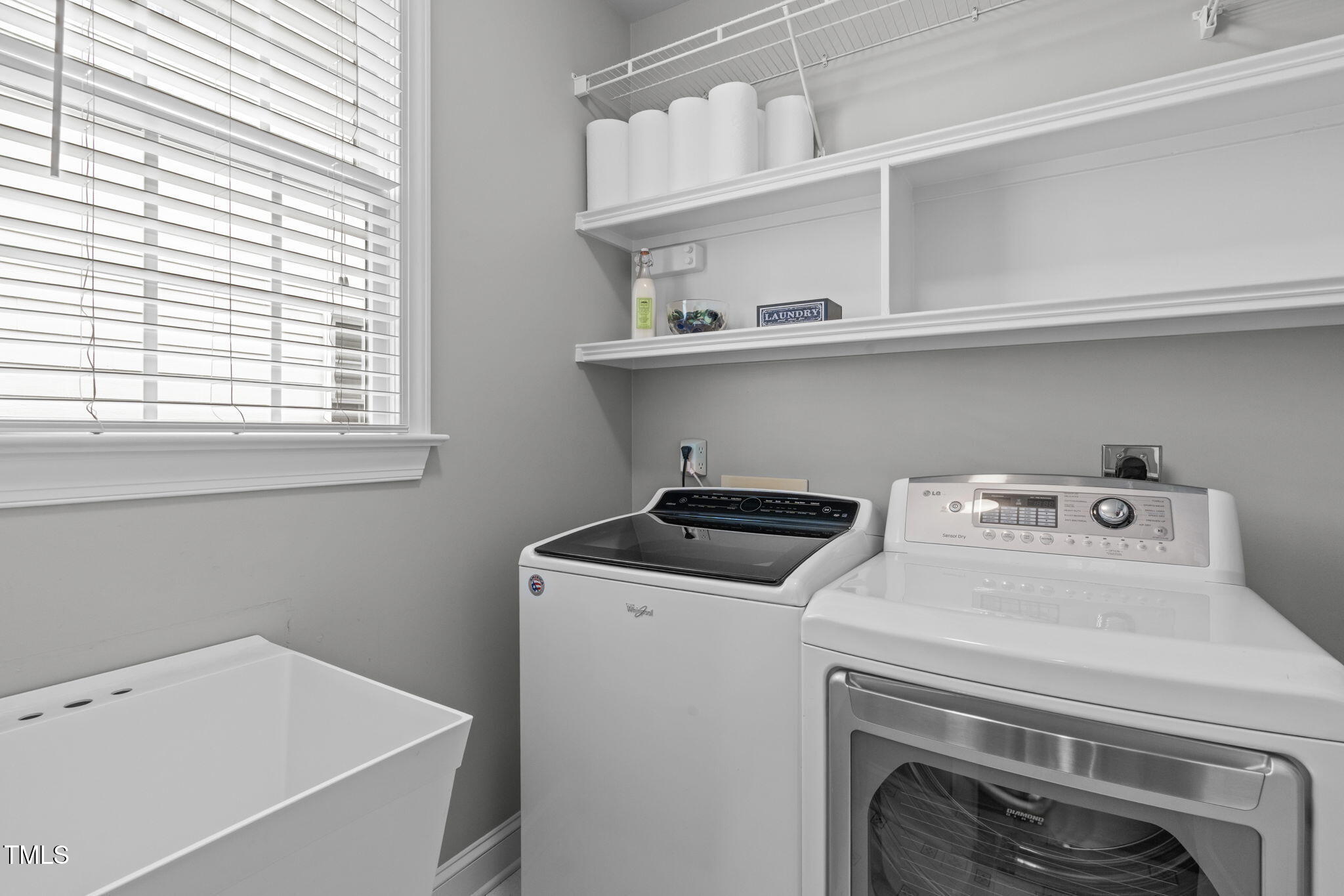 321 Commons Walk Circle Cary, NC 27519 - Photo 29 of 54 a utility room with dryer and washer