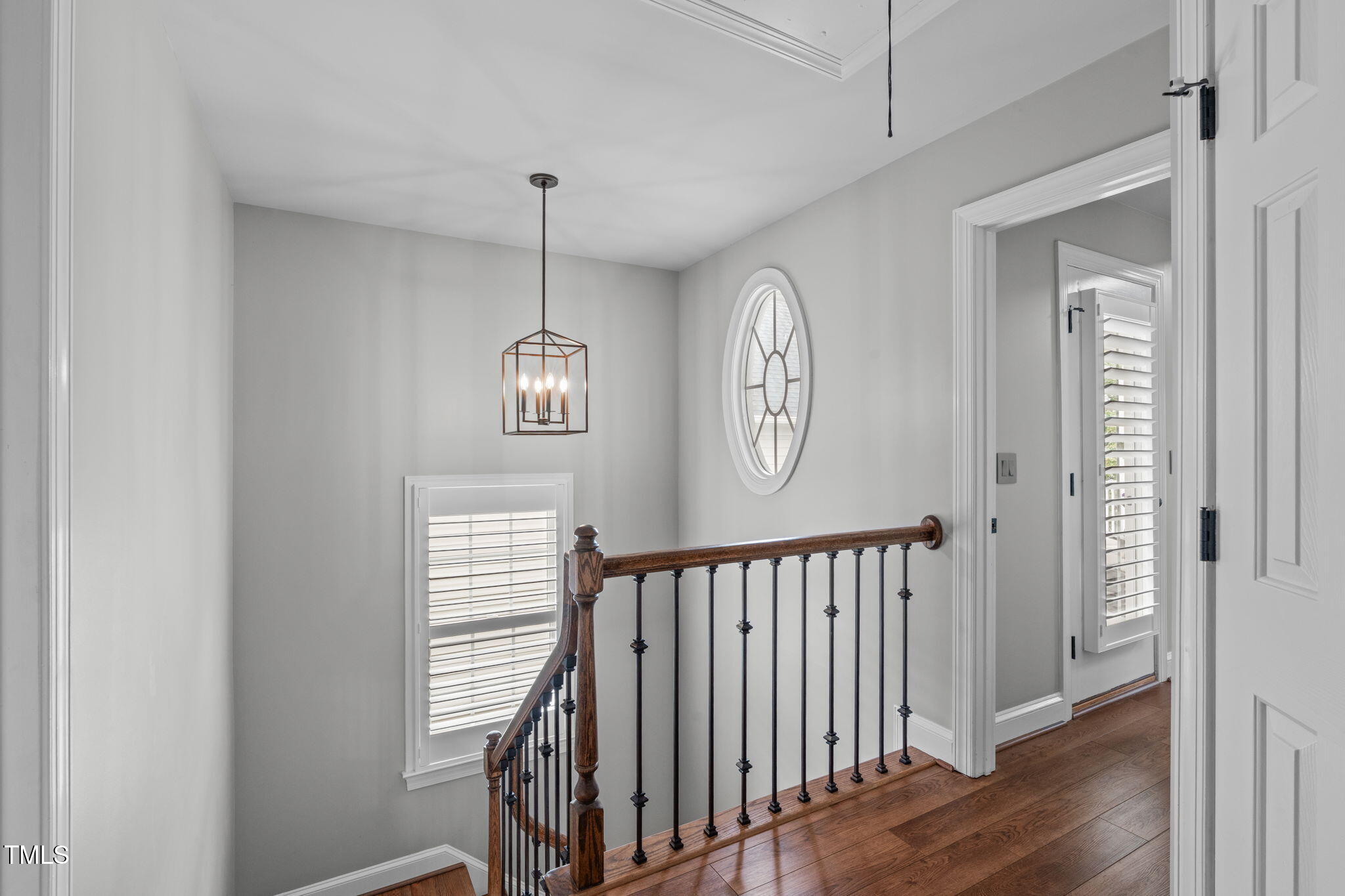 321 Commons Walk Circle Cary, NC 27519 - Photo 30 of 54 a view of a hallway with wooden floor and stairs