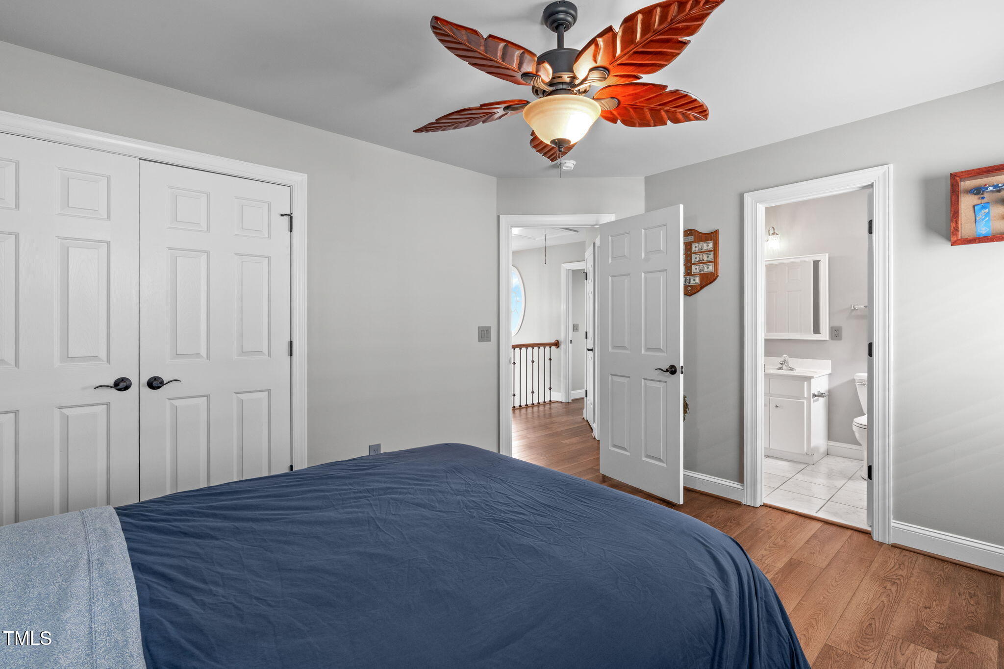 321 Commons Walk Circle Cary, NC 27519 - Photo 33 of 54 a bedroom with a bed and a chandelier