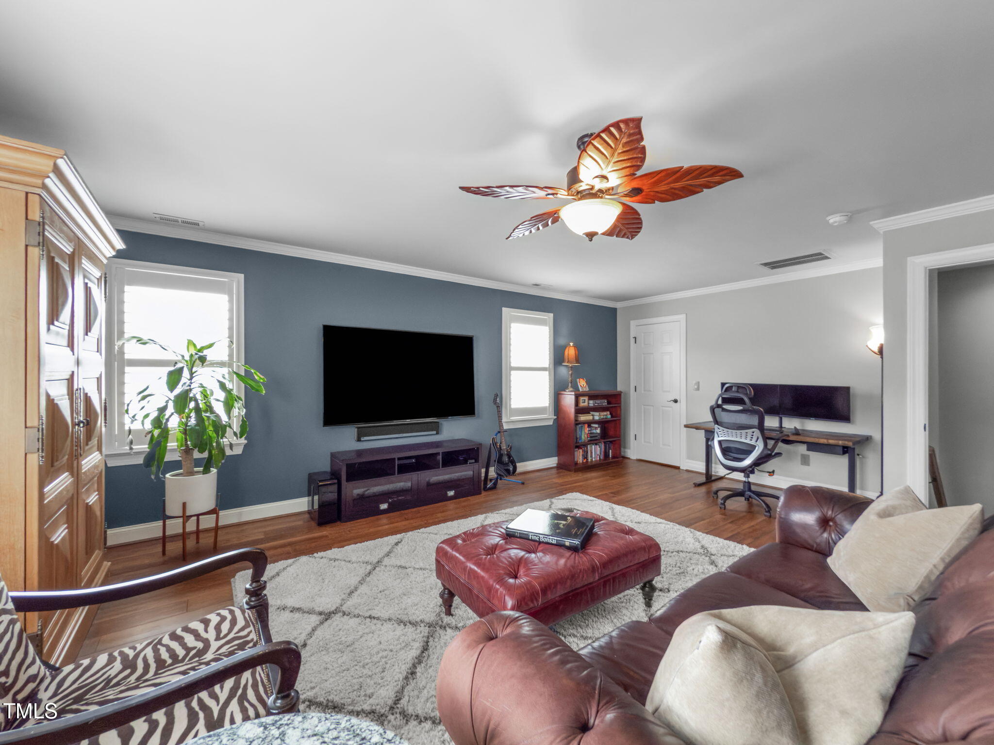 321 Commons Walk Circle Cary, NC 27519 - Photo 37 of 54 a living room with furniture and a flat screen tv