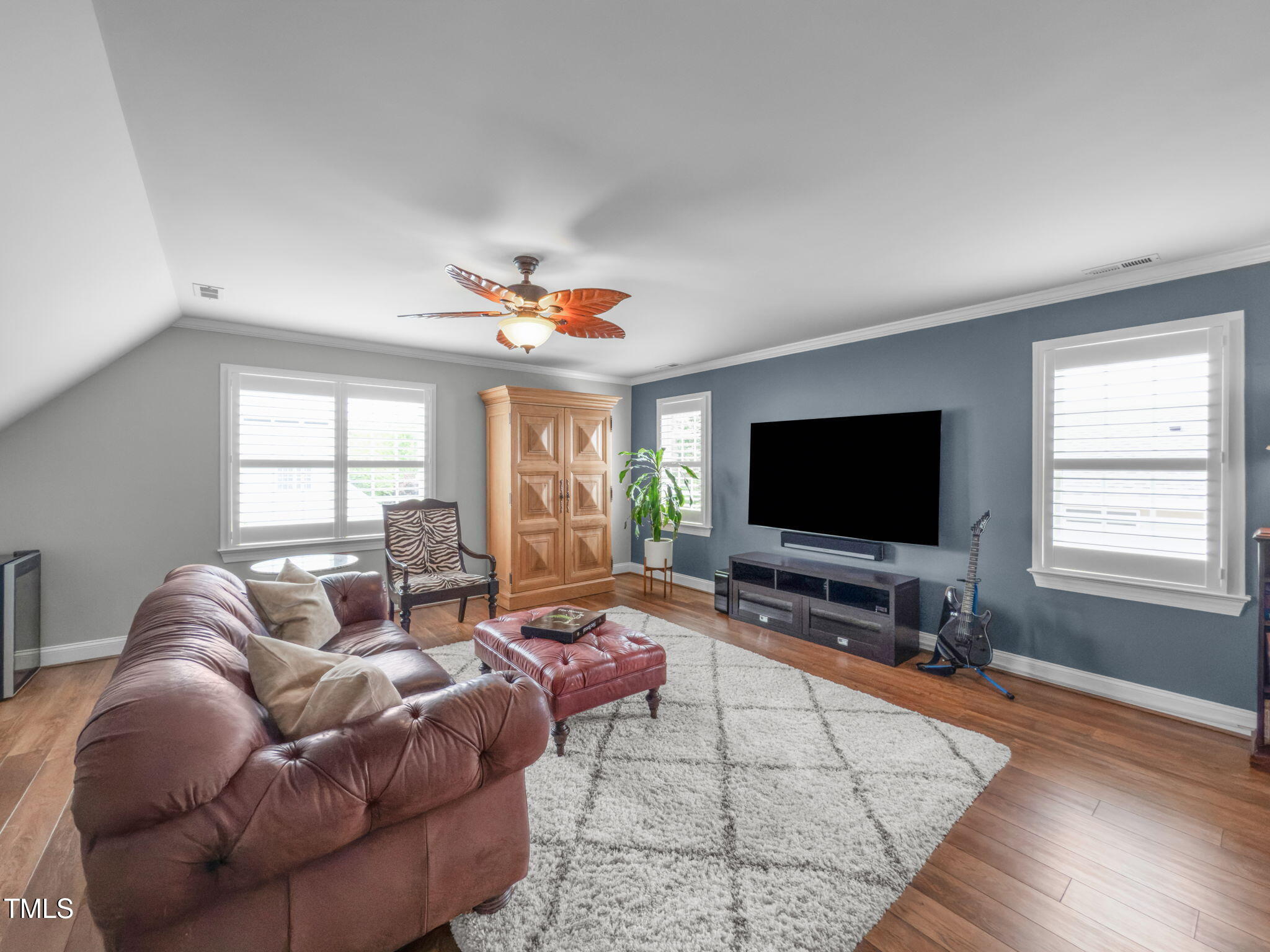 321 Commons Walk Circle Cary, NC 27519 - Photo 38 of 54 a living room with furniture and a flat screen tv