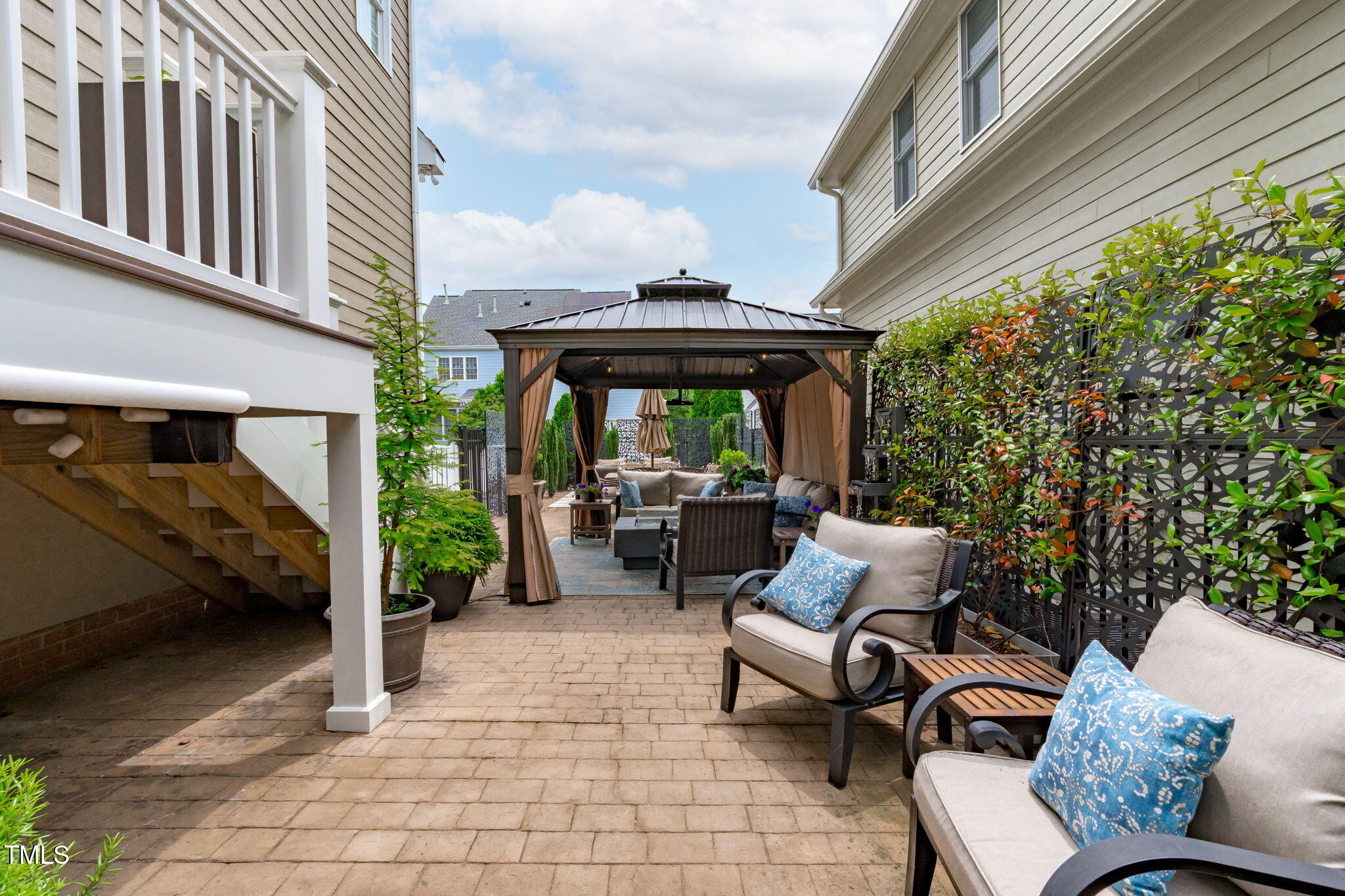 321 Commons Walk Circle Cary, NC 27519 - Photo 46 of 54 a view of patio with a table and chairs and potted plants