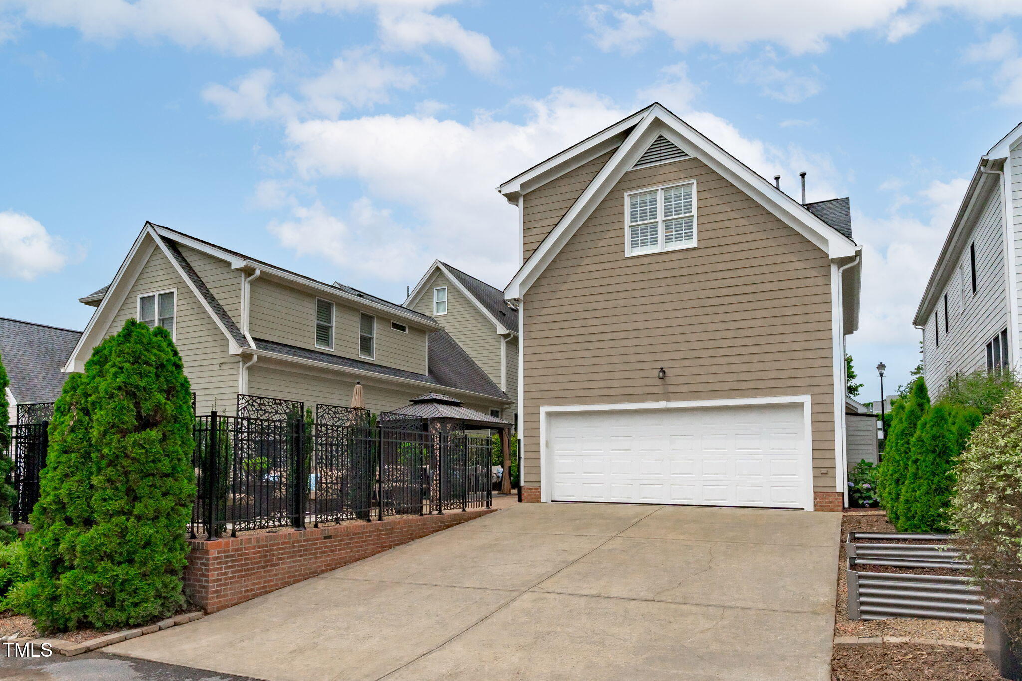 321 Commons Walk Circle Cary, NC 27519 - Photo 48 of 54 a front view of a house with a garage