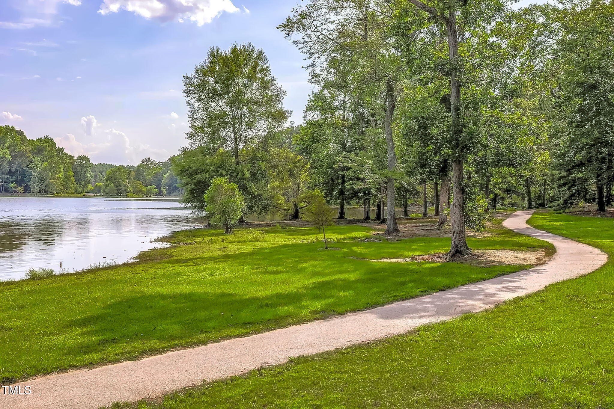 321 Commons Walk Circle Cary, NC 27519 - Photo 52 of 54 a view of a lake with houses in the background