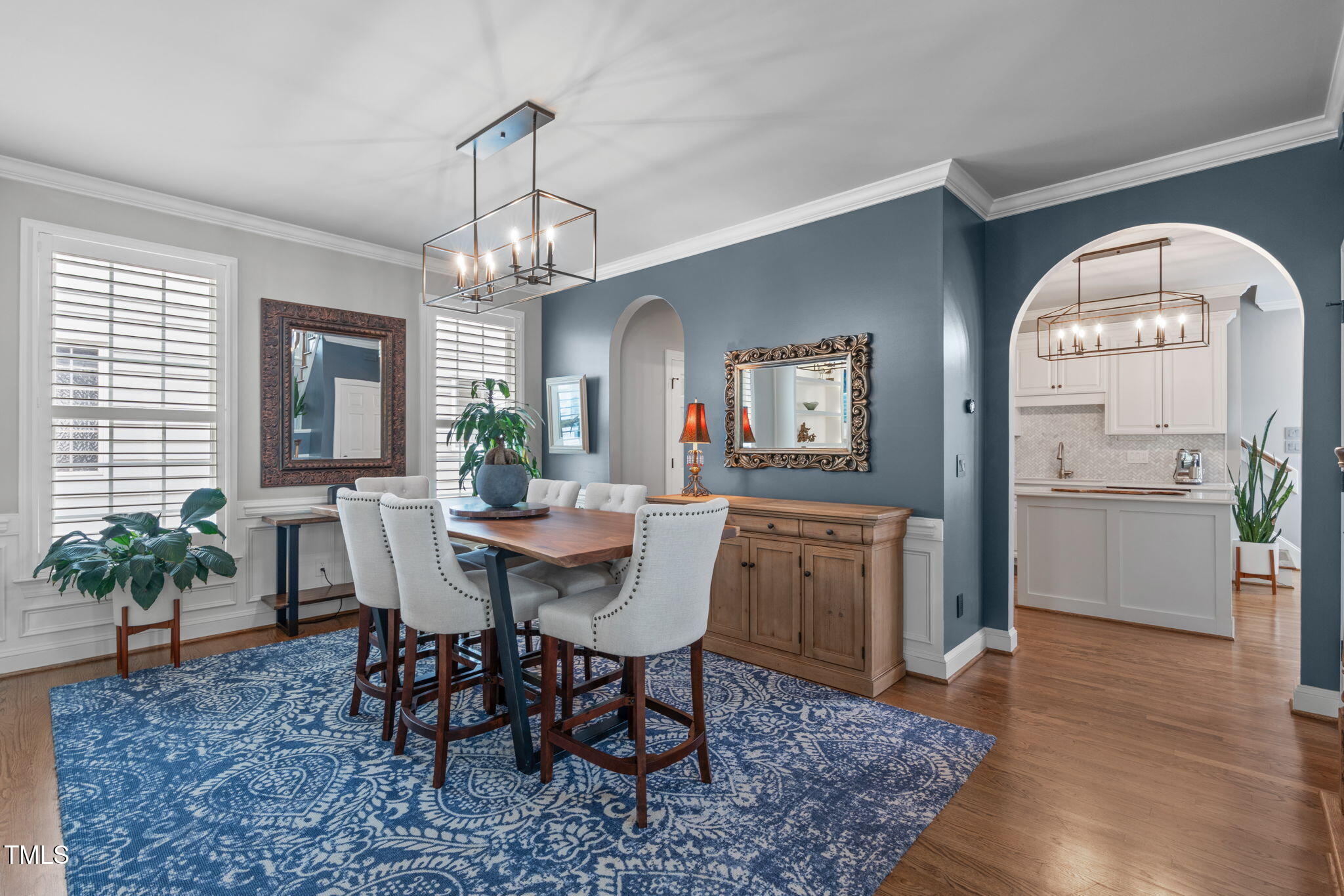 321 Commons Walk Circle Cary, NC 27519 - Photo 7 of 54 a view of a dining room with furniture window and wooden floor