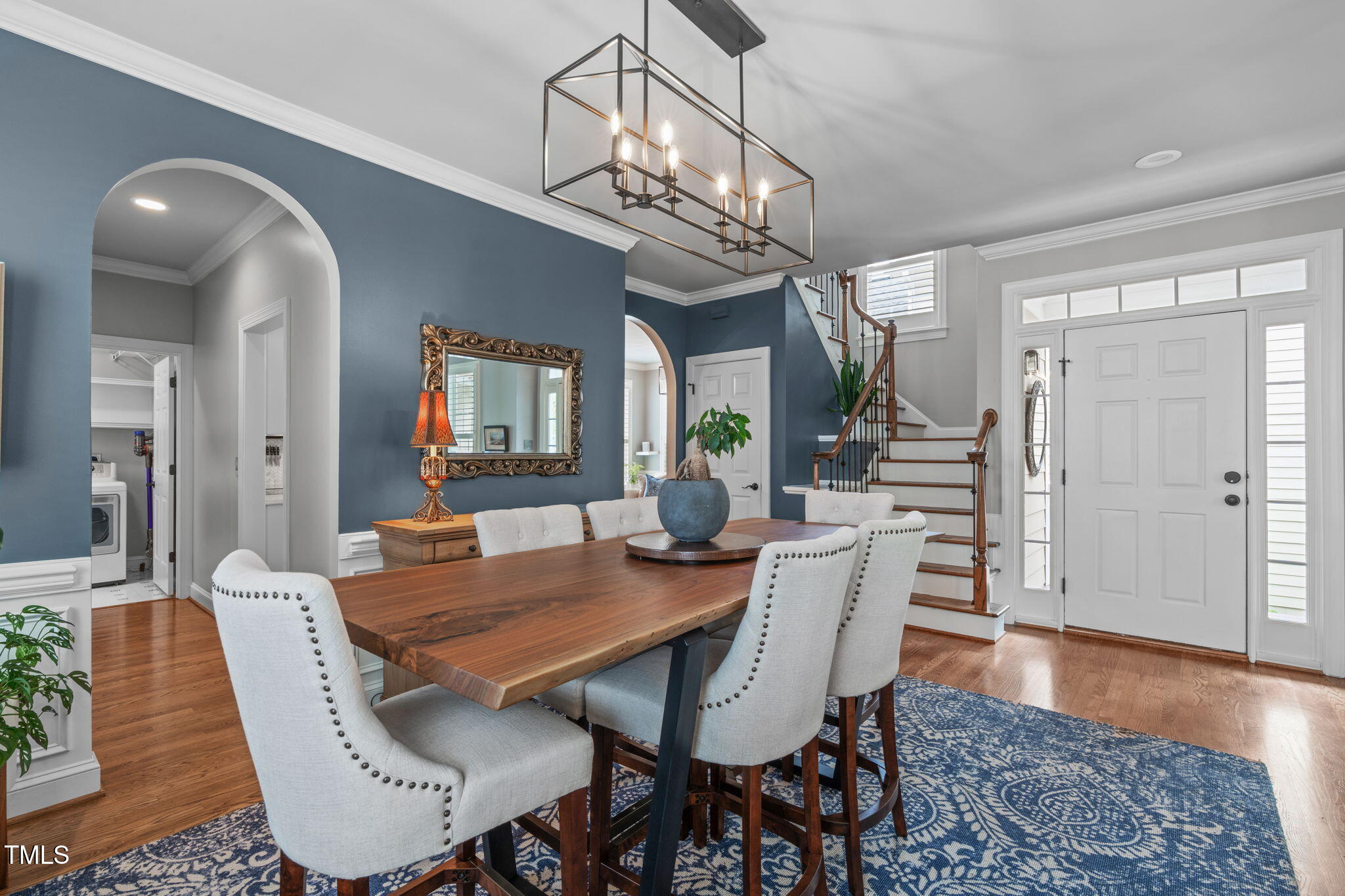 321 Commons Walk Circle Cary, NC 27519 - Photo 8 of 54 a view of a dining room with furniture wooden floor and chandelier