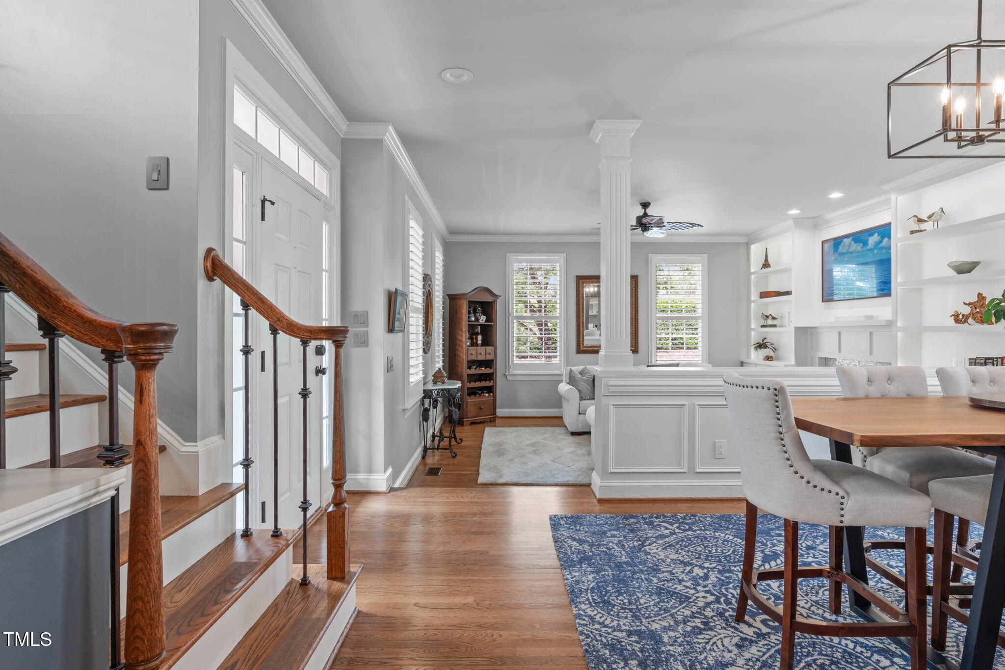 321 Commons Walk Circle Cary, NC 27519 - Photo 9 of 54 a large white kitchen with sink and wooden floor