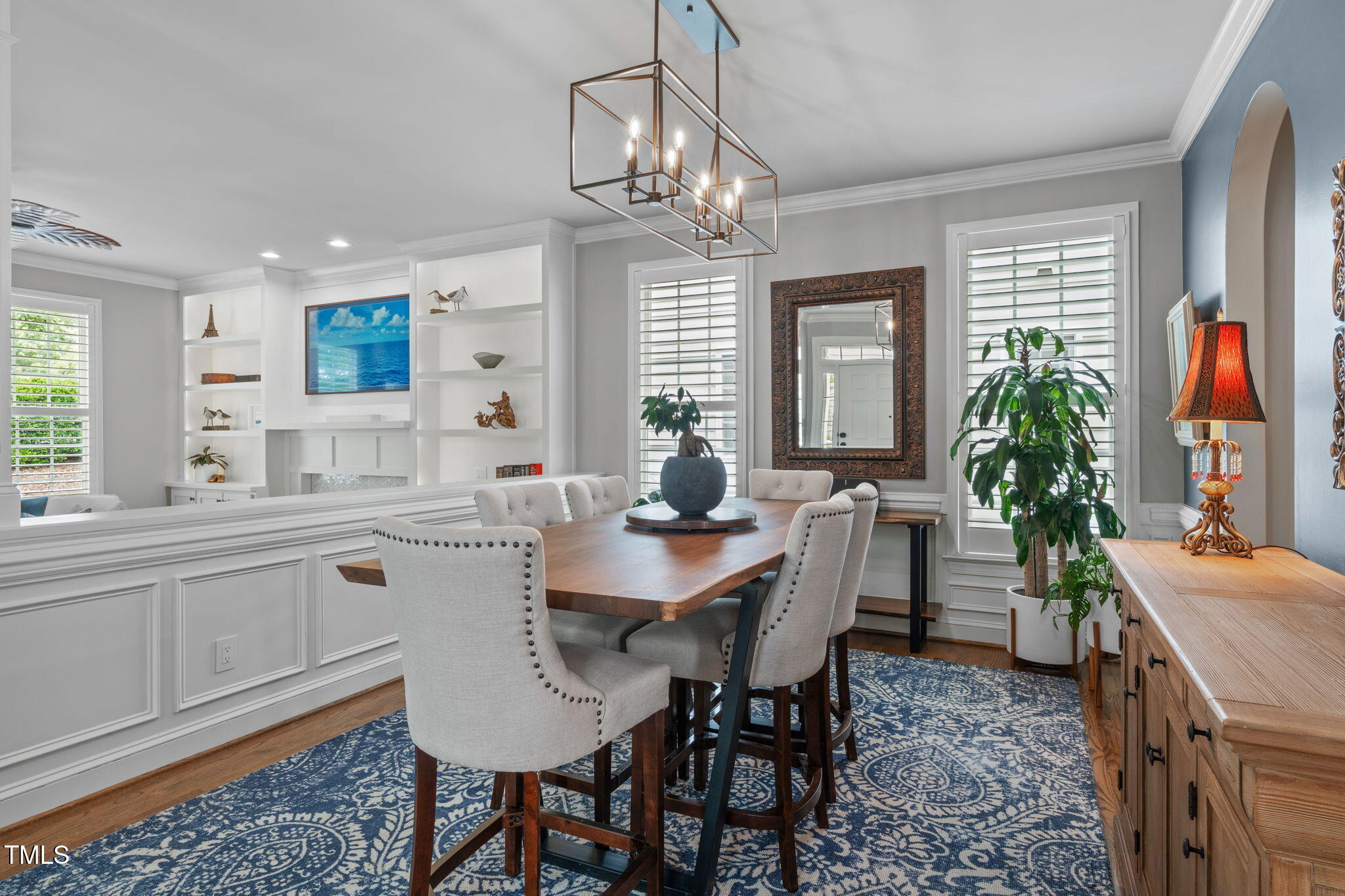 321 Commons Walk Circle Cary, NC 27519 - Photo 10 of 54 a view of a dining room with furniture wooden floor and chandelier