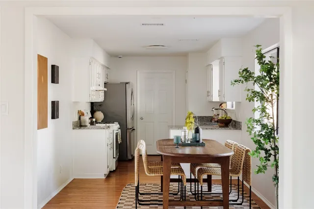 a view of a workspace with furniture and potted plant