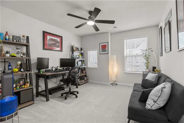 a workspace with furniture and a window