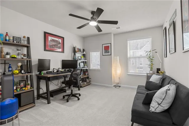 a workspace with furniture and a window