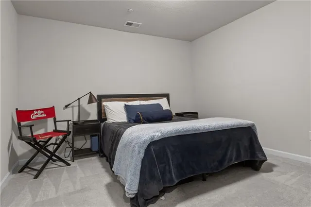 a bed room with a bed and furniture