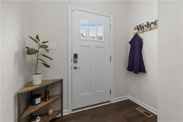 a room with a window and a lamp