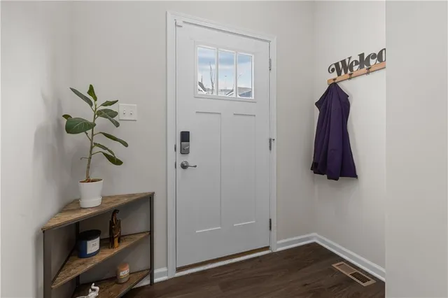 a room with a window and a lamp