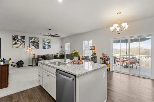 a view of living room with granite countertop furniture and fireplace