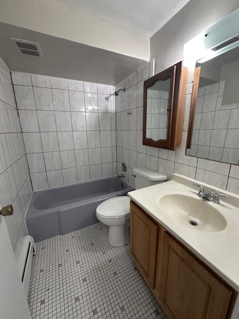 11655 South Pulaski Road, Unit 1B Alsip, IL 60803 - Photo 5 of 10 a bathroom with a sink a toilet and shower