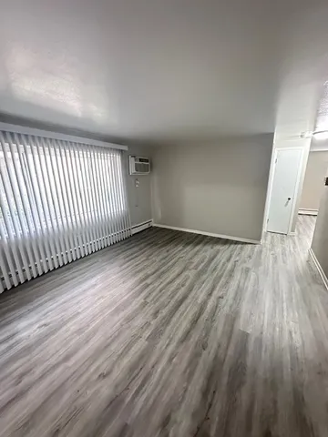 wooden floor in a hall with an entryway