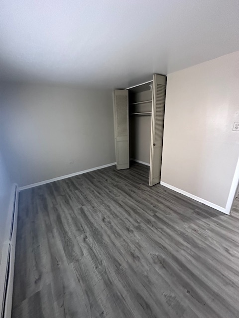11655 South Pulaski Road, Unit 1B Alsip, IL 60803 - Photo 8 of 10 a view of an empty room with wooden floor and closet