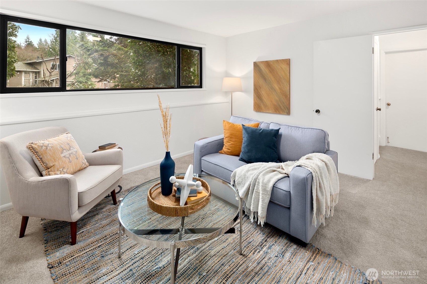 17612 Valley Cir Drive Bothell, WA 98012 - Photo 16 of 26 a bedroom with a bed and wooden floor