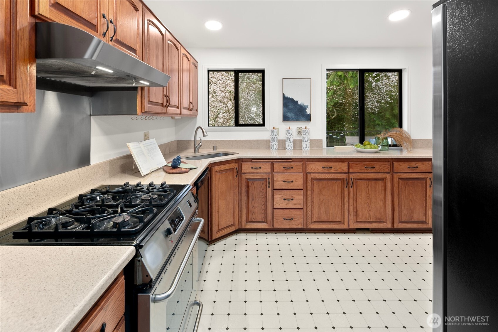 17612 Valley Cir Drive Bothell, WA 98012 - Photo 8 of 26 a kitchen with stainless steel appliances a stove a sink and a refrigerator