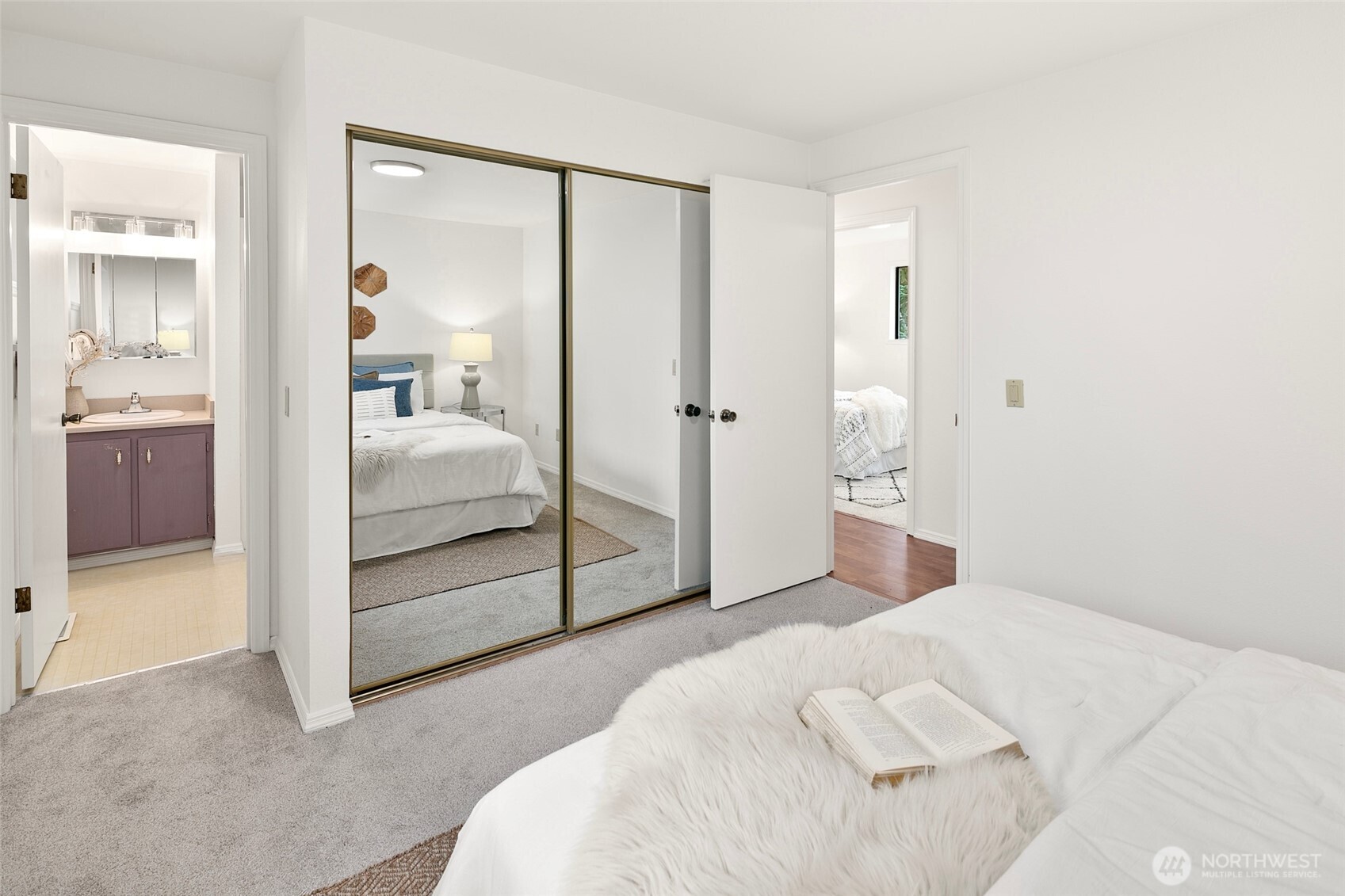 17612 Valley Cir Drive Bothell, WA 98012 - Photo 10 of 26 a bedroom with a bed and a view of bathroom