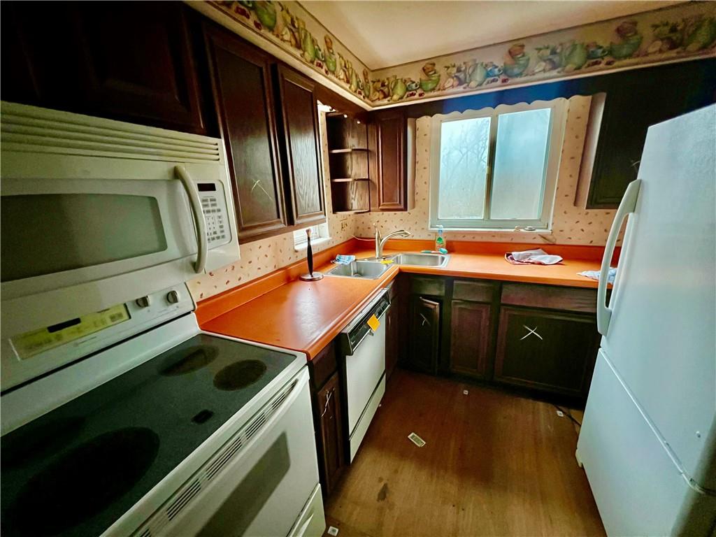 4142 Steiger Street Pittsburgh, PA 15234 - Photo 15 of 18 a kitchen that has a sink and a stove