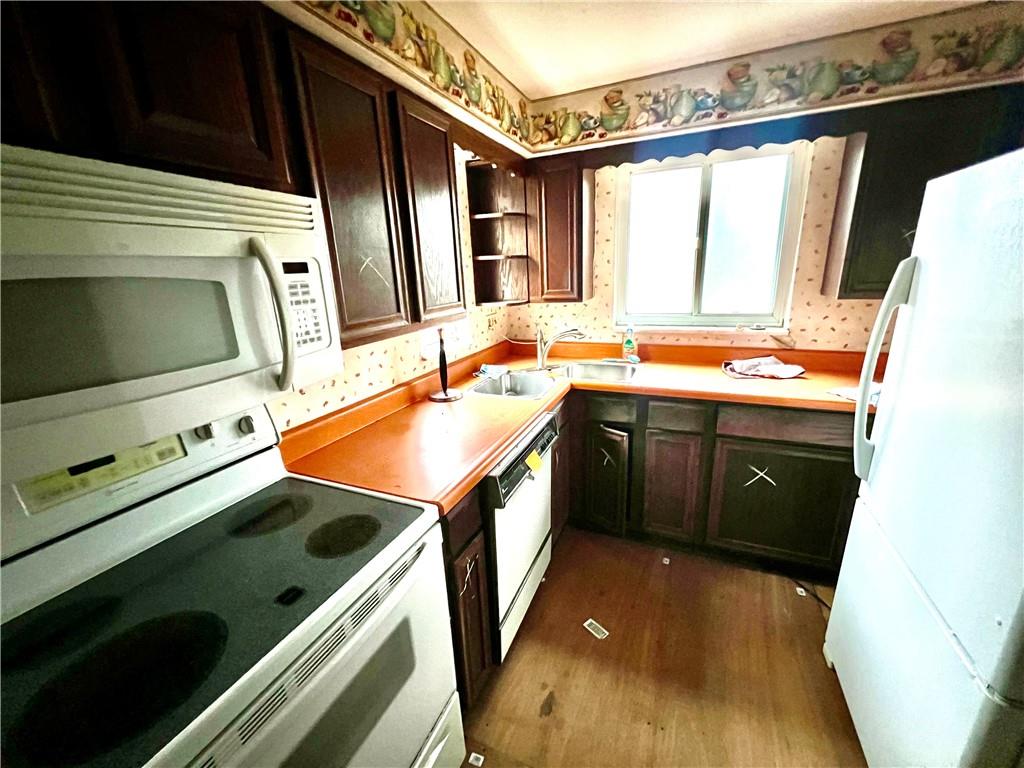 4142 Steiger Street Pittsburgh, PA 15234 - Photo 16 of 18 a kitchen that has a sink and a stove