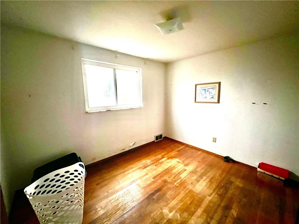 4142 Steiger Street Pittsburgh, PA 15234 - Photo 6 of 18 a view of room with window and wooden floor