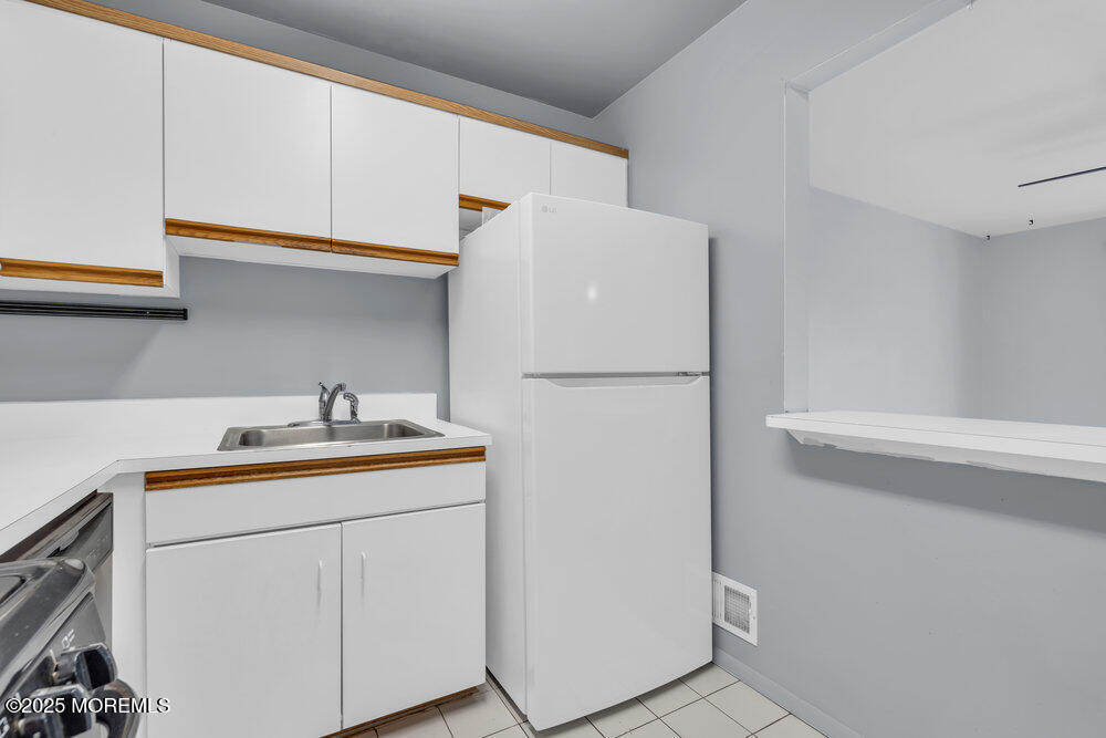 3403 Bridge Avenue, Unit 13 Point Pleasant, NJ 08742 - Photo 11 of 27 a utility room with dryer and washer