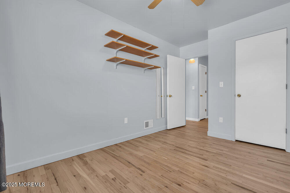 3403 Bridge Avenue, Unit 13 Point Pleasant, NJ 08742 - Photo 14 of 27 a view of an empty room with wooden floor