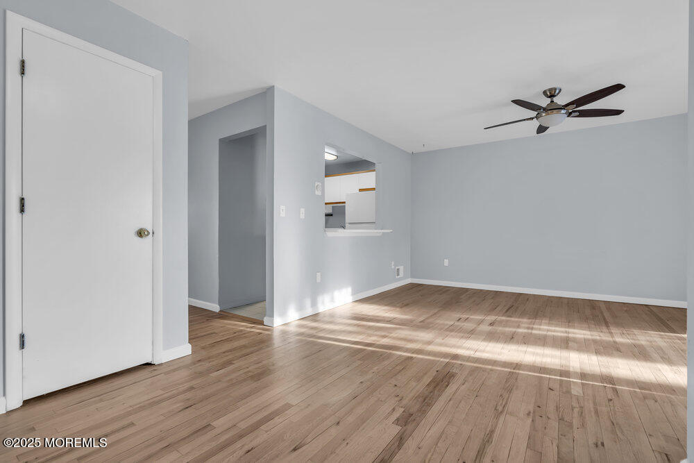 3403 Bridge Avenue, Unit 13 Point Pleasant, NJ 08742 - Photo 2 of 27 a view of empty room with wooden floor
