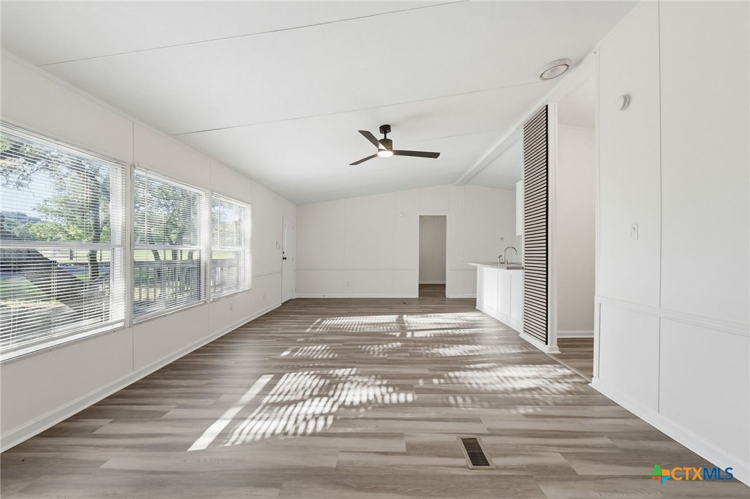 2739 Willow Loop Kempner, TX 76539 - Photo 8 of 30 a view of an empty room with wooden floor and a window