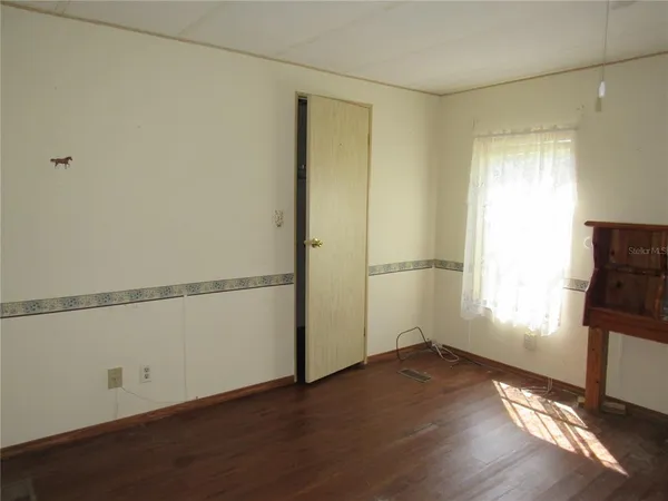 a bathroom with a sink and mirror with toilet