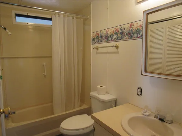 a bathroom with a tub and a sink