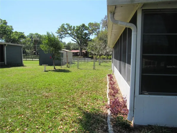 a backyard of a house with lots of green space