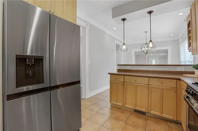 a kitchen with a refrigerator and countertop