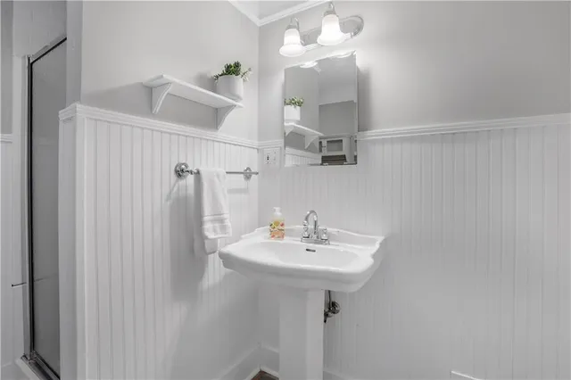 a bathroom with a sink a mirror and vanity