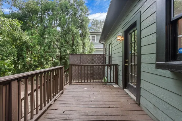 a view of balcony with deck and wooden floor